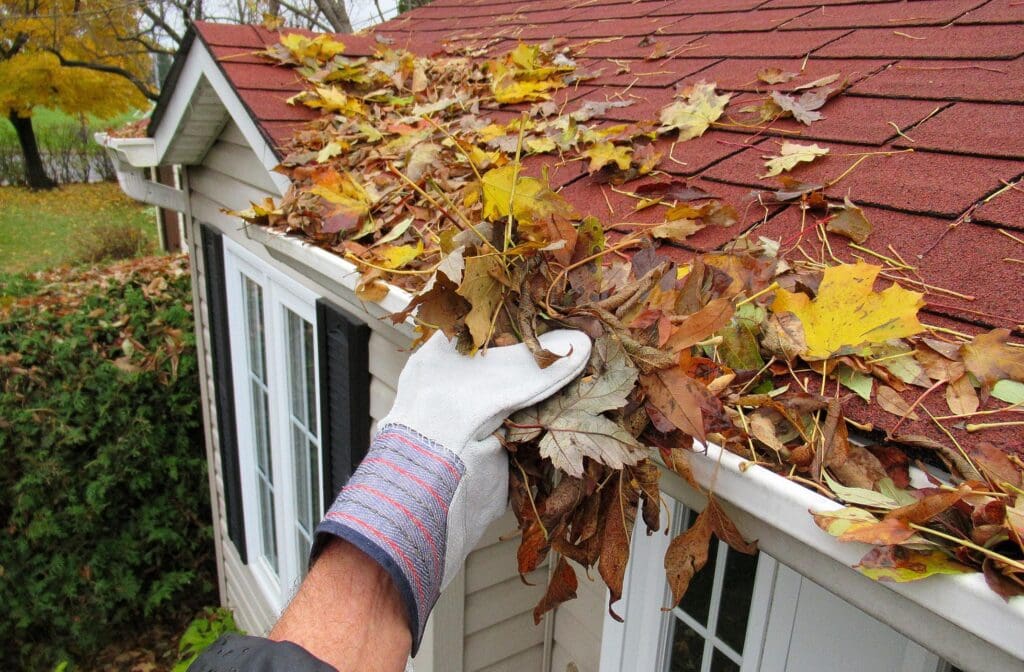 Fall home maintenance includes checking and cleaning gutters before winter