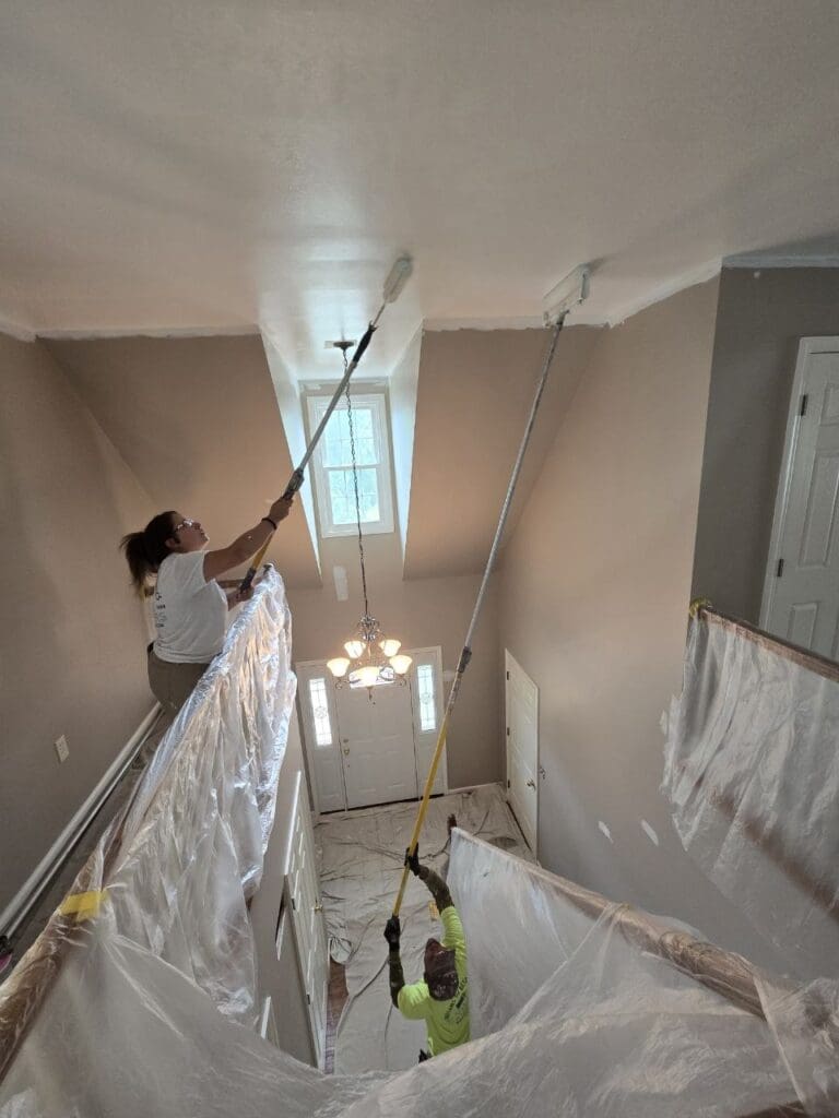 Ville Painters crew protecting a home during an interior painting project. 